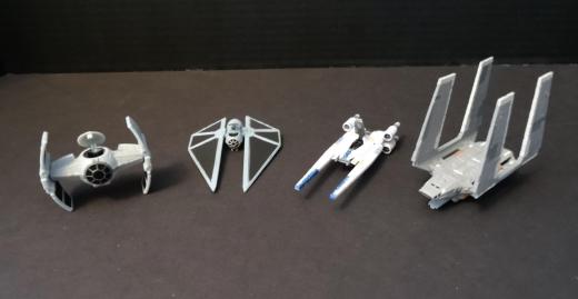 Most vehicles don't need stands. The exception is the TIE Striker (second from left), which has no landing gear and looks awkward in its resting position.